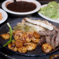 Fajita Trio · Alamo Cafe favorite. A combination of our famous char-broiled  chicken, beef and shrimp  wit...
