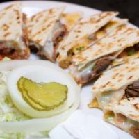 Brisket Quesadillas · Chopped beef brisket, melted American and Monterey Jack cheese and fresh pico de gallo, laye...