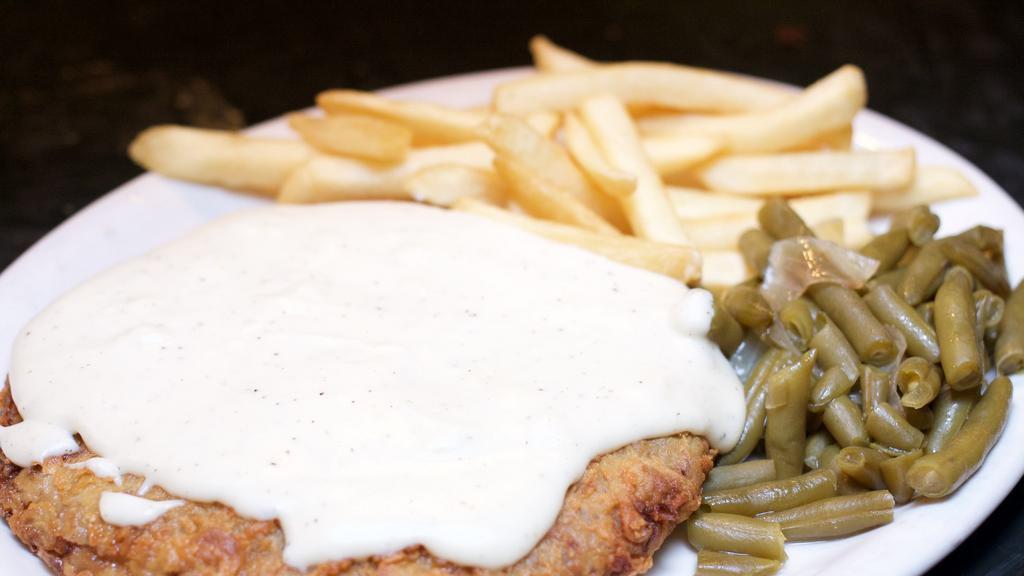 Chicken Fried Steak · Alamo Cafe favorite. Our Texas-style serving of fresh tender beef, specially battered, fried golden brown, and covered in cream gravy. Served with choice of two sides.