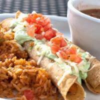 Flautas · Tightly rolled corn tortillas filled with seasoned chicken in a mild red sauce. Fried crisp ...