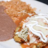 Chile Relleno · Fresh Anaheim pepper, battered and fried crisp, covered with your choice of meat, ranchero s...