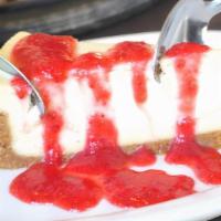 Strawberry Cheesecake  · Vanilla cheesecake topped with sliced strawberries in a strawberry syrup.