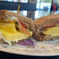Happy Healthy Breakfast Sandwich · Scrambled eggs, roasted zucchini and yellow squash, cheddar cheese, tomato, and herb cream c...