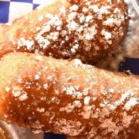 Fried Twinkies · 2 Twinkies, Served w/ Choice of Chocolate Syrup, Caramel Syrup or Both