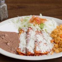 Enchiladas Mexicanas · Three enchiladas filled with ( Queso fresco, Shredded Chicken or Potato) topped with queso f...