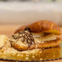 Whipped Cream, Nutella, Bananas And Ground Crackers Croissant · Non-GMO Flour, Purified Water, Butter, Egg, Yeast, Salt, Sugar, Nutella, Bananas, Ground Cra...