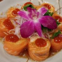 French Kiss · Spicy crab meat wrapped with fresh salmon (ponzu and sriracha).