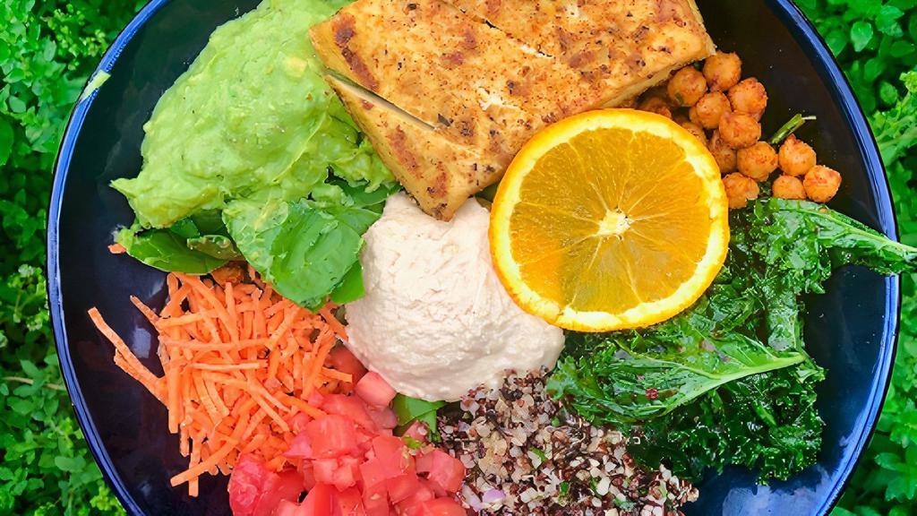 Protein Salad · Kale salad, fresh spinach, chickpeas, quinoa tabouli, ground flaxseed, chickpea hummus, carrots, tomatoes, guacamole and roasted tofu.