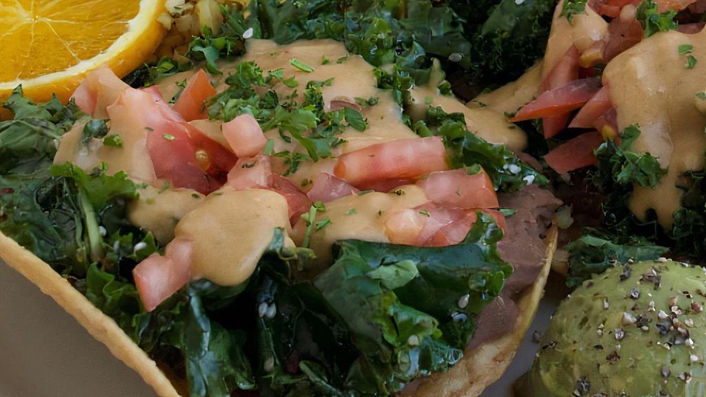 Kaleupas · Two crispy corn tortillas topped with kale salad, refried beans, shredded cheese, chopped field greens and tomatoes. Guacamole and chia seed brown rice on the side. Made with gluten free ingredients. ****VEGAN OPTION MAY CONTAIN NUTS AND GLUTEN****