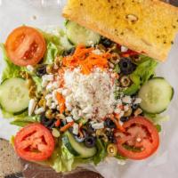 Greek Salad · Lettuce, tomato, bell pepper, cucumber, black olives, green olives, Feta cheese, and peppero...