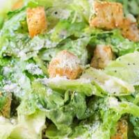 Caesar Salad · Romaine lettuce, fresh tomato, croutons and Parmesan cheese.