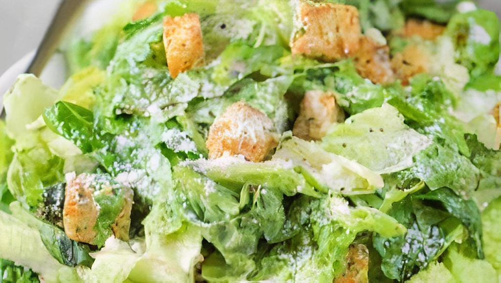 Caesar Salad · Romaine lettuce, fresh tomato, croutons and Parmesan cheese.