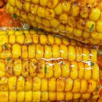 Corn · boiled with cajun seasoning.