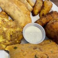 Tropicana Plate · Includes a tamale Cuban, croquetas, papa rellena, fried plantains, tostones, fried yuca, and...