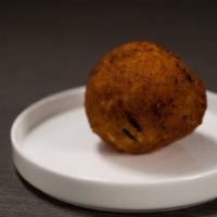 Papa Rellena · Lightly fried breaded puréed potatoes rolled into a ball and stuffed with ground beef.