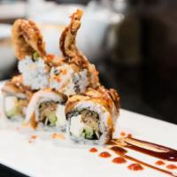 Angry Dragon Roll · Soft shell crab, cream cheese, cucumber inside, topped with baked eel, shrimp, eel sauce, sp...