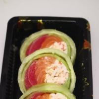 Naruto · Salmon tuna avocado and imitation snow crab inside wrapped with cucumber drizzled with chef ...