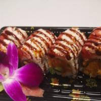 Tokyo Roll · Spicy salmon and avocado topped with snow crab, spicy tuna, and eel sauce on top.