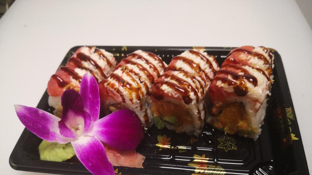 Tokyo Roll · Spicy salmon and avocado topped with snow crab, spicy tuna, and eel sauce on top.