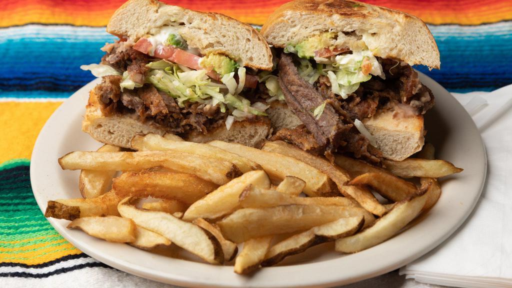 Tortas · Choice of meat with lettuce, tomatoes onions, avocado, beans, mayo and fries.