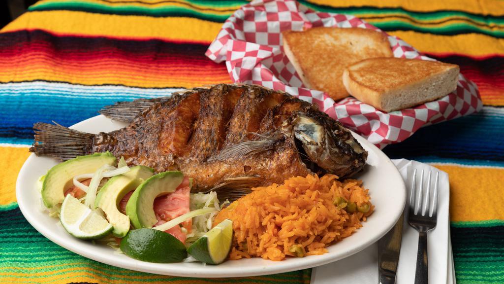 Mojarra Frita · Served with 2 sides of either rice, salad, beans, or fries and comes with bread