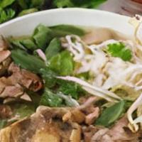 Oxtail Pho – Phở Đuôi Bò · Rice noodle in flavorful beef broth with topped with onion scallion and cilantro. served wit...