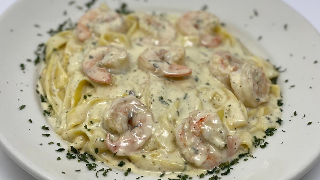 Shrimp Fettuccine Alfredo · Shrimp with creamy white wine sauce over a delicious bed fettuccine pasta.