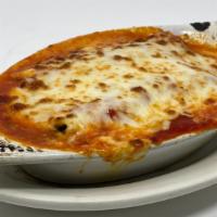 Manicotti · Shell filled with ricotta, mozzarella and parmesan  cheeses, and marinara.