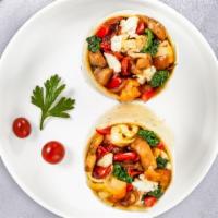 Midnight Mediterranean Breakfast Burrito · Spinach, mushrooms, tomatoes, feta cheese, eggs, tomatoes and onions wrapped in a flour tort...