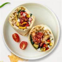 Eat Your Veggie Burrito · Grilled seasonal vegetables topped with sour cream, salsa, cheese, and spanish rice wrapped ...