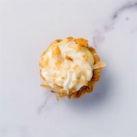 Coconut Cream Pie · Coconut pastry cream topped with toasted coconut.