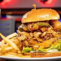 Revel Brisket Burger · Two grilled 7oz brisket blend burgers, pepper jack cheese, topped with smoked pulled pork, j...