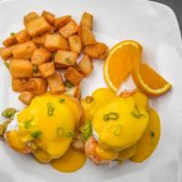 California Benedict · *Two poached eggs on Texas toast, topped with avocado, grilled shrimp, and smothered with ho...