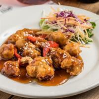 Orange Chicken · Deep-fried breaded chicken or choice of protein, bell pepper, cashew nut, and sesame seeds i...