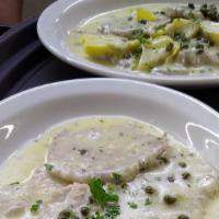 Chicken Piccata · Sautéed chicken scallopini with artichokes and capers in a butter and lemon sauce.