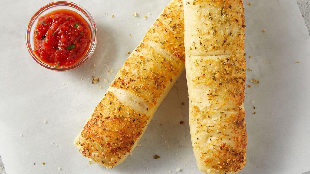 Breadsticks · Topped with creamy garlic sauce and seasoning, served with pomodoro sauce.
