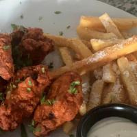 Wings · Delicious chicken wings with sauce.