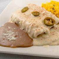 Enchiladas · Two enchiladas with meat and sauce. Served with refried beans and rice.