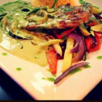Pollo Puebla · Grilled chicken breast, slowly marinated with Mexican herbs, topped with poblano pepper sauc...