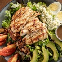 Cobb Salad · Grilled chicken breast, mixed greens, tomatoes, avocado, egg, bacon, blue cheese crumbles, t...