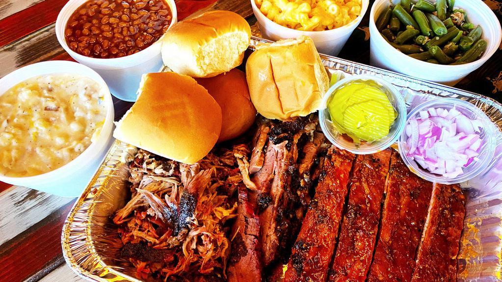 Family Bbq Meal · 3 Meats (2.5 lbs total), 4 sides, your choice of bread and sauces. Feeds 4-5 people. Must choose 3 different meats. Additional meat can be purchased by the 1/4 pound.