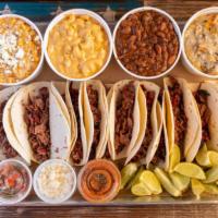 Family Taco Meal · 12 street tacos with your choice of meat and 4 pints of sides. Also comes with our house-mad...