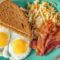 American Breakfast · Two eggs any style, toast or English muffin, bacon, sausage, grilled ham steak or thin-cut b...