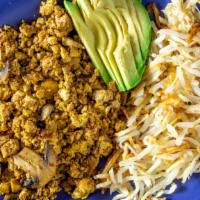 Vegan Scramble · Vegan. Soft tofu scramble, mushrooms, topped with avocado and served with hashbrowns (no but...