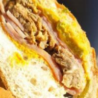 Cuban Sandwich · Slow roasted pulled pork, grilled ham, Swiss American cheese, mustard, pickles on toasted Fr...