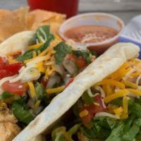 Chicken Tacos · Chicken breast with peppers and onions. Topped with lettuce, pico de gallo, and Cheddar. Two...