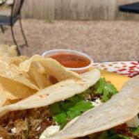 Poblano Pork Tacos · Slow-cooked Cuban mojo pork tossed on the grill with roasted poblano peppers and onions. Top...
