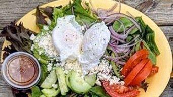 Organic Spring Mix Salad · A large salad with tomatoes, cucumbers, red onion, feta, avocado, and your choice of dressing.