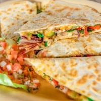 Veggie Quesadilla · Vegetarian. Cheddar and provolone cheese, bell peppers, onions, mushrooms, and baby spinach,...