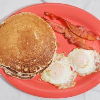 Breakfast Special · Two eggs, three pancakes, bacon, sausage, chorizo, or ham.